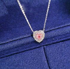 "Add a touch of elegance and glamour to your look with our stunning Pink Diamond Heart Necklace. Crafted with the finest materials, features a heart-shaped design encrusted with brilliant pink diamonds that sparkle and shine in the light. The necklace is made with high-quality materials to ensure durability and long-lasting wear. The pink diamonds are expertly cut and polished to enhance their natural beauty and brilliance. The heart-shaped design is classic and timeless, making this necklace pe Luxury White Gold Necklace For Valentine's Day, Luxury Heart Necklace For Wedding, Elegant Cubic Zirconia Heart Necklace For Party, Luxury Diamond White Heart Necklace For Wedding, Luxury Heart Necklace For Wedding On Valentine's Day, Luxury Heart Cut Necklace For Valentine's Day, Luxury Necklace For Wedding And Valentine's Day, Luxury Diamond White Necklaces For Valentine's Day, Luxury Heart Pendant Necklace For Party