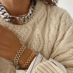 This stylish and modern Anisa Sojka watch band bracelet combines silver and gold for a unique, chunky look. Crafted from quality metals, it is sure to be a luxurious and long-lasting addition to any wardrobe. Silver meets gold, the dashing duo. Add a touch of edgy luxe to your look with this bold bracelet. Stack for a statement. Product DetailsMetal: 18K Gold Plated Stainless SteelLength: 18cm Width: 1cm Weight: 38gFold Over Clasp Bracelet Storage, Chunky Chain Necklace, Timeless Watches, Watch Band Bracelet, Bold Necklace, Chunky Chain Necklaces, Simple Tees, Band Bracelet, Classic Watches