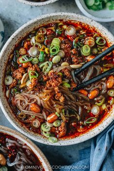 two bowls filled with beef and vegetable soup