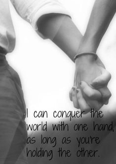 two people holding hands with the words i can conquer the world with one hand, as long as you're holding the other