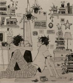 two people are sitting on the floor in front of a wall with pictures and plants