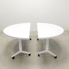 two white tables sitting on top of each other