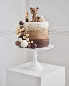 there is a cake that has been decorated with chocolates and teddy bears on it