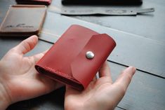 "The original design of the purse, chic red vegetable tanned leather! Wallet size 3.94 × 3.54 inch / 10 × 9 cm. 📍Making You are in the maker's shop 😉 Every wallet is cut and sewn from the very scratch using traditional methods and tools for working with natural leather! 📍Personalization Embossing service you can find in \"OPTIONS\" in every listing. We can emboss almost everything that is needed, company logos, names, phrases, car logos, numbers, dates, and much more) 📍Leather Skin color you can find in \"OPTIONS\" in every listing. We use the highest quality aged cowhide.  It is durable but soft. The torturous nature allows it to age beautifully, mostly by recording the life story of its owner. 📍Production and shipping time We make your item and ship your package in 3-7 business days Red Leather Coin Purse With Card Slots, Red Leather Trifold Wallet For Everyday, Red Leather Everyday Card Holder, Red Leather Bifold Coin Purse, Red Leather Card Holder With Coin Pocket, Red Leather Trifold Wallet For Daily Use, Red Leather Wallet With Card Slots, Red Bifold Coin Purse For Everyday, Red Leather Coin Purse With Interior Card Slots