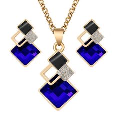 Expertly handcrafted, this stylish crystal pendant and earring set features a matching pendant and pierced earrings. This fine jewelry set comes in red, white, yellow, blue, green, gray, peacock blue, light blue, and pink all with gold trim and gold link chain. This is a perfect gift for a bridal party, engagement, wedding, birthday, graduation, Mother's Day, or the holiday season. Blue Alloy Earrings For Gift, Blue Alloy Pendant Jewelry, Elegant Blue Alloy Jewelry Sets, Gift Dangle Jewelry Sets, Multicolor Crystal Pendant Jewelry, Crystal Necklace And Earring Set For Gifts, Crystal Pendant Jewelry Set For Party, Crystal Necklaces With Matching Earrings For Gift, Blue Alloy Dangle Jewelry