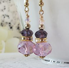 Beautiful amethyst dangle earrings are sure to look fabulous with any outfit! Made with faceted crystal beads and gold accents. Earrings measure 1 1/4 inches. Diy Jewelry Unique, Beading Ideas, Jewelry Luxury, Jewelry Unique, Faceted Crystal, Crafts Ideas, Product Photos, Purple Amethyst, Jewelry Ideas