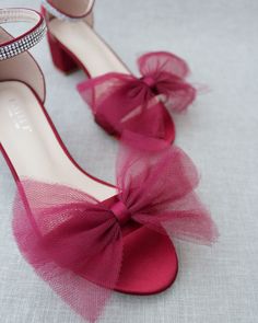 Classy satin block heel with oversized front tulle bow. Simple yet elegant are great combination and will definitely be a favorite.DETAILS:FIT: RUNS LARGE, ORDER ONE SIZE DOWNHEEL HEIGHT: 1.25 inches (kids) & 2 inches (women)RIBBON WIDTH: 1.5 inchesCOLORS AVAILABLE: Black, Burgundy, Champagne, Ivory, Navy, White, Light Blue, Soft BlushUPPER: Synthetic upper and liningMATERIALS: Mandmade outsole STYLE NAME: NAOMI Pink Block Heels With Bow, Pink Wedding Sandals With Bow, Pink Block Heels, Bridesmaids Shoes, Tulle Bow, Holiday Shoes, Tulle Bows, Bridesmaid Shoes, Blue Soft