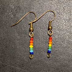 waterproof glass beaded minimalistic pride earrings Trendy Jewelry For Pride Gifts, Adjustable Jewelry For Pride Festival Gift, Rainbow Nickel-free Drop Earrings, Nickel-free Rainbow Drop Earrings, Trendy Rainbow Jewelry For Pride, Rainbow Dangle Earrings For Everyday, Rainbow Adjustable Minimalist Jewelry, Hypoallergenic Rainbow Drop Earrings, Minimalist Adjustable Rainbow Jewelry