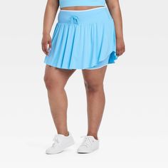 Why we're ALL IN: Solid-color seamless skort with soft gathers and wrap-style accents on the sides. Boasts a midweight nylon and spandex construction with four-way stretch as well as moisture-wicking properties to help keep you cool and comfy during any activity. The wide waistband with drawcord, built-in brief, mini length and mid-rise waist complete the sporty design. All in Motion™: Inspiring the potential in every body. Sporty Stretch Blue Swim Skirt, Blue Stretch Nylon Swim Skirt, Blue Stretch Swim Skirt For Sports, Blue Moisture-wicking Tennis Skirt For Sports, Sporty Stretch Blue Tennis Skirt, Blue Moisture-wicking Swim Skirt For Sports, Solid Color Swim Skirt For Spring Sports, Blue 4-way Stretch Athleisure Skort, Blue 4-way Stretch Sporty Skort