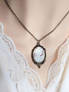 #jewelry #necklaces #cameonecklaces #cameonecklace #victoriannecklace #portraitcameo #girlfriendgift #cameojewelry #vintagestyle #victorianjewelry #statementnecklace #prkjewelry #greekgoddess #dianathehuntress #gothiccameo #giftideasforwomen #wedding #weddingjewelry Vintage Cameo Medallion Necklace, Victorian Cameo Pendant Necklace, Antique Cameo Necklace With Round Pendant, Antique Cameo Round Pendant Necklaces, Ornate Cameo Necklace For Gift, Victorian Oval Cameo Pendant Necklace, Cameo Round Pendant Necklace For Wedding, White Cameo Necklace For Gift, Wedding Necklaces With Cameo Round Pendant