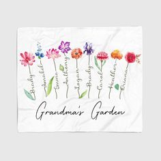 a towel with flowers on it that says momma's garden