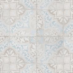 a blue and white tiled floor with an intricate design