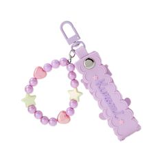 a purple beaded keychain with a name on it and a star charm