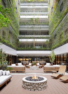 an indoor courtyard with seating and fire pit