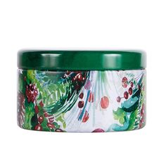 a green lidded container with an image of berries and leaves printed on the bottom