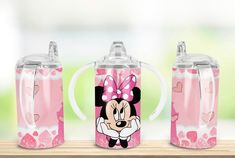 minnie mouse sippy cup with lid and straw in the shape of a heart on it