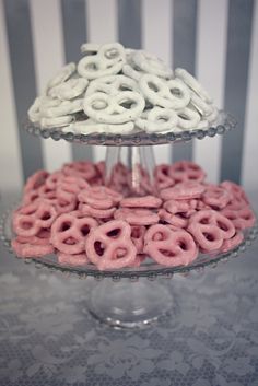 three tiered cake plate with pink and white donuts