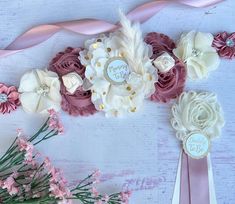 some flowers and ribbons on a table