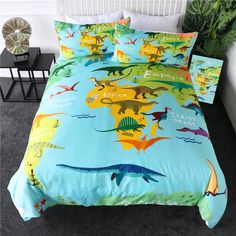 a bed with dinosaurs on it in a room