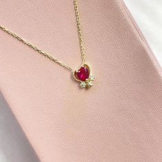 Introducing our stunning Gold Heart Garnet Gemstone Necklace, a timeless piece of jewelry that will elevate any outfit with its elegant and sophisticated design. Crafted from high-quality, this necklace features a delicate heart-shaped pendant that is embellished with a brilliant, deep red garnet gemstone. The warm tones of the gold perfectly complement the rich, vivid color of the gemstone, creating a beautiful contrast that is sure to catch the eye. Measuring 18 inches in length, the necklace Silver Promise Rings, Claw Ring, Ruby Birthstone, Promise Rings For Her, Black Onyx Ring, Cz Ring, Onyx Ring, Vivid Color, Necklace Dainty