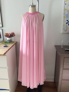 Pink peignoir gown. Chiffon material. Magnetic clasp in back, open sides for better movement. Gown has a sit in back for easy removal. Long fabric belt included. I can create this item in any color, please message me. Pink Chiffon Floor-length Gown, Pink Floor-length Chiffon Gown, Flowy Pink Silk Chiffon Maxi Dress, Pink Silk Chiffon Evening Maxi Dress, Pink Silk Chiffon Maxi Dress For Evening, Long Pink Chiffon Dress, Elegant Pink Silk Chiffon Maxi Dress, Pink Flowy Floor-length Gown, Pink Chiffon Maxi Dress For Evening