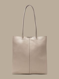 The perfect day tote, designed with a low-profile shape so it packs flat, made in sturdy, luxe leather.  Magnetic snap closure.  2 interior slip pockets.  Faille lining.  LEATHER WORKING GROUP: By purchasing this product, you are supporting responsib Banana Republic, Leather Working, Tote Bag, Leather