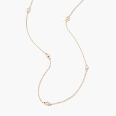 This Juliet 14K Gold Station Diamond Necklace is a sparkly sensation. With five floating diamonds encased in luxurious 14K gold, this necklace adds a touch of sophistication and glamour to your look - you deserve it! Available in 14k yellow gold Pendant size: 1/8" Lab Grown Diamonds Diamond size: 2mm round diamond 16" cable chain with 2" extender Spring ring closure SKU: BYND0007 Delicate Gold Diamond Necklace With Single Cut Diamonds, Luxury Diamond Station Necklace With Delicate Chain, Luxury Gold Station Necklace With Diamond Accents, Classic 14k Gold Chain Necklace With Diamond Accents, Elegant Everyday Chain Necklace With Diamond Accents, Elegant Gold Diamond Necklace For Everyday Luxury, Dainty Gold Diamond Station Necklace, Classic Gold Diamond Necklace With Rose Cut Diamonds, Elegant 14k Gold Necklace With Rose Cut Diamonds