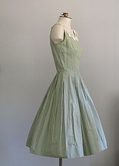 APPROXIMATE MEASUREMENTS (INCHES): Current Size: XS/S Bust: 34 Waist: 24 Hip: OPEN Bodice (shoulder to waist): 15 1/2 Skirt (waist to hem): 25 CONDITION Excellent DESCRIPTION 1950s sundress Fit & flare style Green and white cotton gingham fabric Back metal zip closure No tags; handmade 50s Dress Outfit, 50s Dresses Casual, Vintage Gingham Dress For Garden Party, Vintage Plaid Dress For Garden Party, Retro Sleeveless Plaid Dress For Spring, 1950s Style Cotton Summer Dress, Spring Retro Sleeveless Plaid Dress, 50’s Outfits, 1950s Style Plaid Summer Dresses