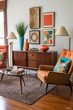 a living room with two orange chairs and a coffee table in front of a window