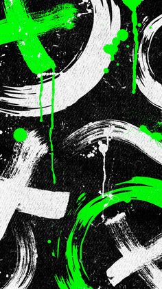 green and white paint splattered on black paper