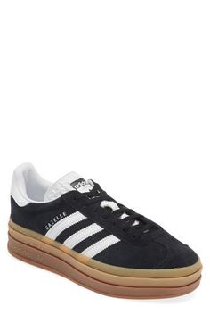 A triple-stacked platform elevates a time-tested sneaker, while serrated side stripes keep it close to its roots. Lace-up style Removable insole Leather upper/synthetic and textile lining/synthetic sole Imported Platform Gazelle, Platforms Aesthetic, Adidas Platform, Fall Shoe Trends, Adidas Gazelle Bold, Fall Shoe, Gazelle Bold, Shoe Trends, Shoe Inspo