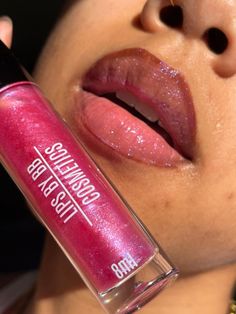 You know she is that girl 💘👄💅🏽Sink your lips into this color shifting baddie of a lip gloss💜💖 💖 Subtle pink tint - shimmery finish 💖 Holographic color shifting gloss - pink, purple + even blue!💖 Non-sticky, hydrating + moisturizing formula💖 One swipe chunky wand applicator💖 Sweet, yummy scent Ingredients: Vegan lip gloss base (Hydrogenated Polyisobutene, Ethylene/Propylene/Styrene Copolymer, Butylene/Ethylene/Styrene Copolymer, Pentaerythrityl Tetra-di-t-butyl Hydroxyhydrocinnamate), Lip Gloss With Glitter, Purple Lip Gloss, Lip Gloss Base, Holographic Color, Vegan Lip Gloss, Shimmer Lip Gloss, Best Lip Gloss, Shiny Lips, Lip Beauty