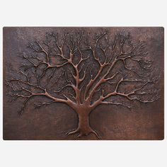 a metal plaque with a tree on it