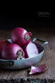 some onions are in a bowl on a table