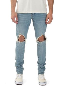 Ripped knees and raw hems lend laid-back style to these skinny jeans enhanced with a bit of stretch to move with you. 98% cotton, 2% Lycra® spandex Machine wash, line dry Imported Asian Founded Urban Fitted Distressed Bottoms, Urban Style Distressed Stretch Bottoms, Urban Ripped Fitted Jeans, Urban Style Ripped Fitted Jeans, Urban Fitted Jeans With Frayed Hem, Urban Stretch Ripped Bottoms, Urban Style Stretch Ripped Bottoms, Streetwear Fitted Jeans With Frayed Hem, Fitted Jeans With Frayed Hem For Streetwear