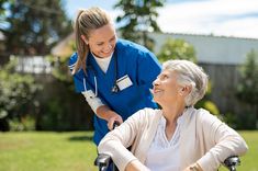 an older woman in a wheel chair with a nurse behind her and the words do carers need payday loan?