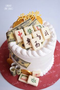 a cake decorated with money and chinese characters