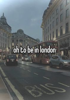 the words oh to be in london are displayed on an image of a city street