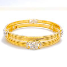 This exquisite set of 18k gold bangles, with a total weight of 34.8 grams, features an elegant floral design adorned with dazzling diamonds. The yellow gold finish enhances their luxurious appeal, making them perfect for any special occasion. Each bangle is set with a total diamond weight of 3.18 carats, featuring F-G color and VS quality diamonds in round, pear, and baguette shapes. With a bangle size of 2.7 and an opening diameter of 2.45 inches, these pieces offer both elegance and comfort. I Traditional Gold Bangle With Diamond Accents, Elegant 22k Gold Wedding Bangle, Dazzling Yellow Gold Bangle For Anniversary, Yellow Gold Wedding Bangle With Diamond Accents, Dazzling Gold Diamond Cut Bangle, Exquisite Yellow Gold Bangle For Anniversary, Gold Bangle With Diamond Accents For Anniversary, Traditional Gold Diamond Bracelet, Exquisite Hand Set Gold Bangle