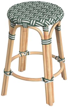 a stool made out of bamboo sticks with green and white designs on the seat cushion