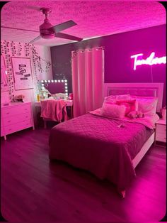 a bed room with a neatly made bed and pink lighting on the wall above it