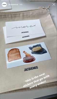 there is a piece of bread and some other items on the table with name tags