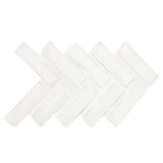 six pieces of white toilet paper stacked on top of each other in the shape of an arrow