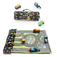 two play mats with cars and trucks on them, one has a roll - up mat