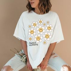 Always Smile Quote T-Shirt, Smiley Face Daisy Flower Shirt, Cute Retro Graphic Print Top, Motivational Tee, Loose Fit Oversized TShirt, Vibe This unisex Gildan 5000 heavy cotton tee is the basic staple of any wardrobe.   🤍 100% cotton  🤍 Classic fit  🤍 Tear-away label  🤍 Runs true to size White T-shirt With Funny Print For Spring, Cute Oversized T-shirt For Spring, Cute Oversized White T-shirt, Spring White Letter Print Tops, Spring Tops With White Screen Print, White Print Screen Printed Tops For Spring, Trendy Oversized Floral Print Tops, Oversized White Floral Print Shirt, Oversized Floral Print T-shirt For Spring