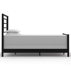 a black bed frame with white sheets and pillows on it, against a white background