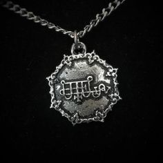 This Sigil of Bune necklace is an handmade pewter sculpture This seal of Bune is one of the 72 Sigils of Goetia from Ars Goetia's DemonologyThis Sigil of Goetia pendant is sold with a stainless steel chainThis Seal of Bune is a pendant of 2.5cm diameterThis Sigil of Bune is a pewter sculpture of my own creation, i create and work the metal by myself at home. The material used is the finest and highest grade hypoallergenic pewter alloy of 98%tinYou can combine many of my creations in an order to Spiritual Silver Jewelry With Antique Finish, Spiritual Silver Jewelry In Pewter, Silver Gothic Jewelry For Ceremonial Occasions, Silver Jewelry With Antique Finish For Ceremonial Occasions, Adjustable Antique Silver Jewelry, Engraved Antique Silver Metal Jewelry, Silver Pewter Jewelry, Symbolic Engraved Metal Jewelry, Etched Silver Jewelry For Festivals