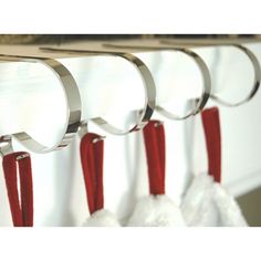 some red and white tassels hanging on a wall