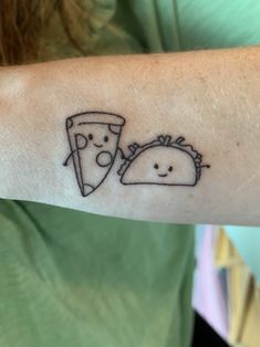 a person with a tattoo on their arm has a taco and a slice of pizza