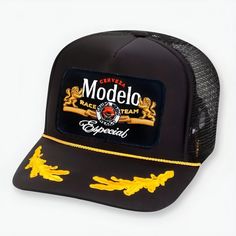 Classic trucker hat featuring a Modelo Especial Race Team patch Adjustable snap back One size fits most Curved, moldable bill Black Trucker Hat With Logo Patch, Black Trucker Hat With Flat Brim, Black Flat Brim Trucker Hat, Black Trucker Hat With Curved Brim, Black Snapback Trucker Hat, Black Trucker Baseball Cap, Black Trucker Hat With Curved Bill, Black Trucker Snapback Hat, Company Gifts